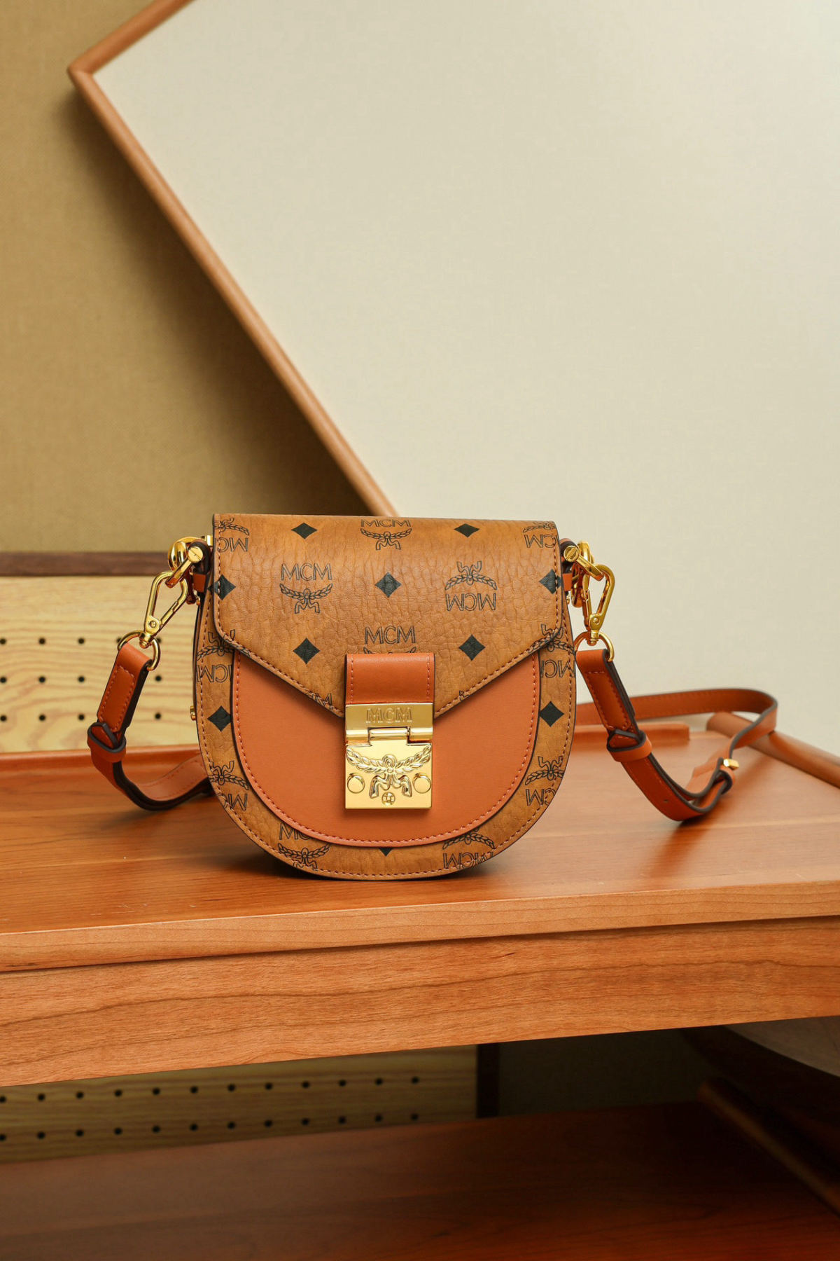 MCM Patricia Visetos Cognac-colored Mini Saddle Crossbody Handbag