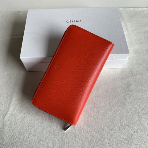 Celine orange-red rippled zip wallet