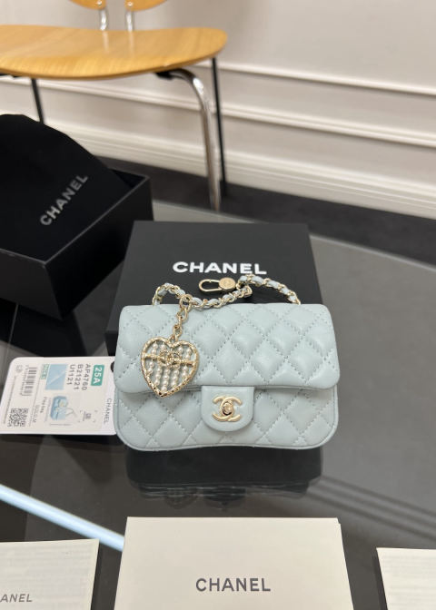 CHANEL small charm bag