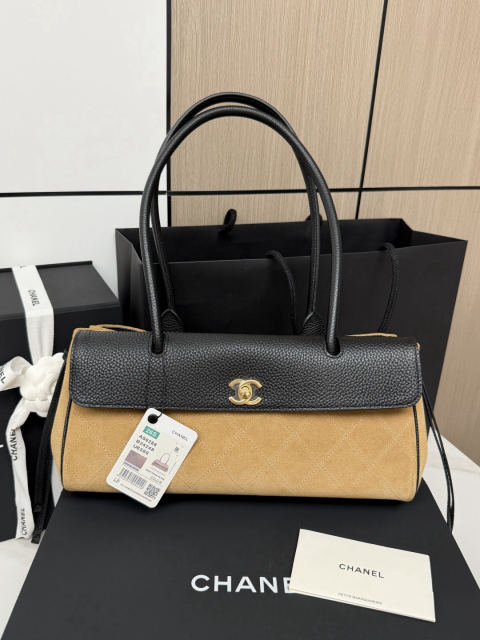CHANEL baguette bag with lychee pattern and black bowling ball design