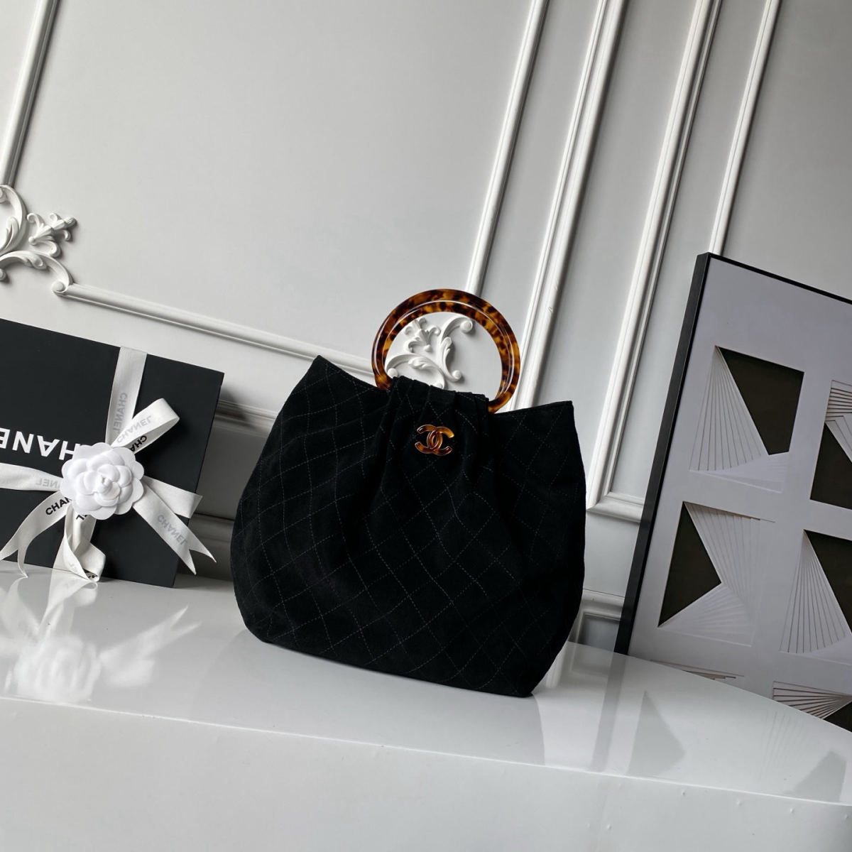 CHANEL suede bucket bag with tortoiseshell handles