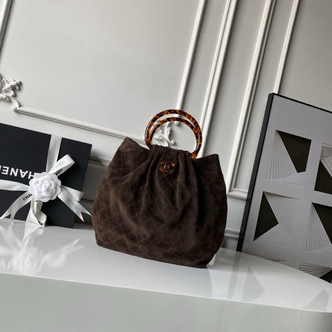 CHANEL suede bucket bag with tortoiseshell handles