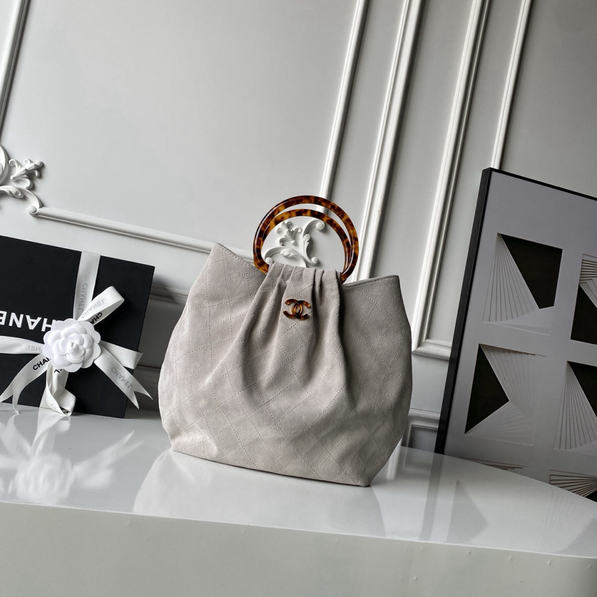 CHANEL suede bucket bag with tortoiseshell handles