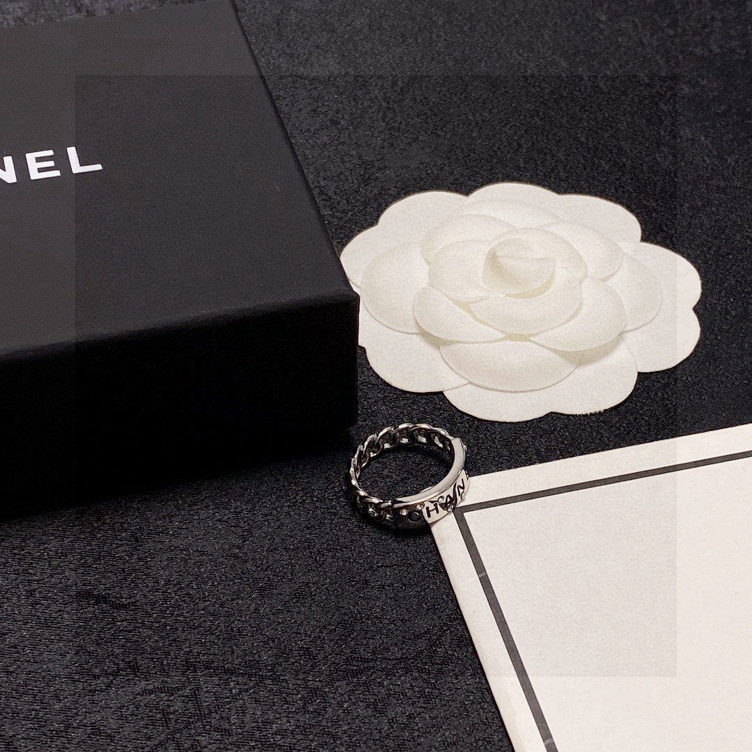 Chanel's double C logo ring with diamond design.