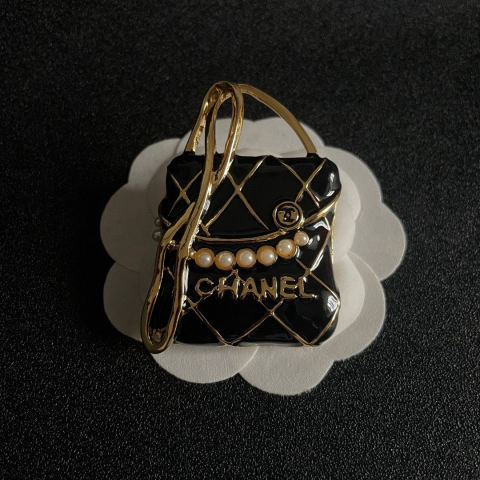 Chanel bag with double C logo brooch