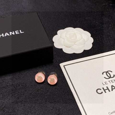 Chanel minimalist summer jelly-colored light pink diamond stud earrings with the double C logo.