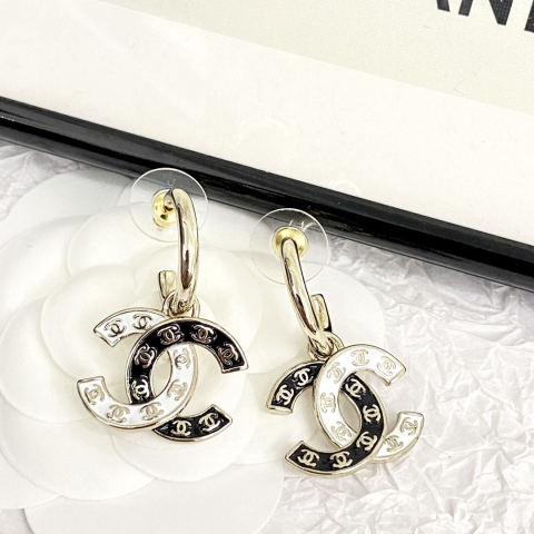 Chanel double C stud earrings with curved hooks and black and white enamel.