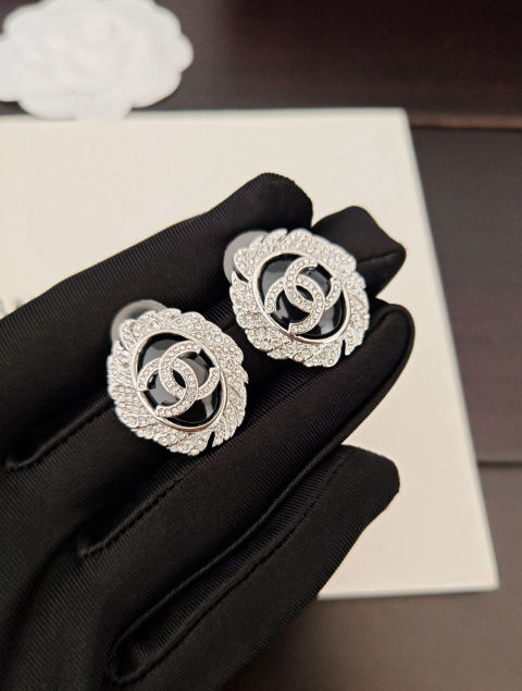 Chanel oval black stud earrings fully adorned with diamonds