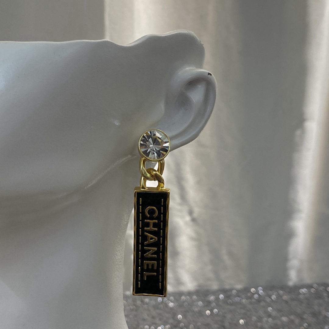 Chanel Black and Gold Leather Rhinestone Letter Stud Earrings