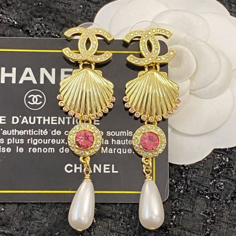 Chanel earrings with rubies, gold shells, colored diamonds, and pearls, pendant earrings.