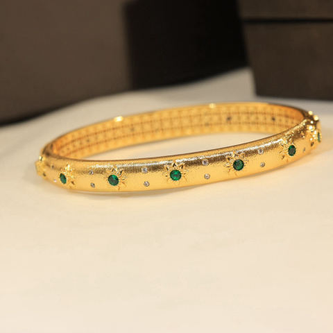 Buccellati, an Italian high-end jewelry brand, presents a vintage-style, courtly-inspired diamond-encrusted brushed bracelet.