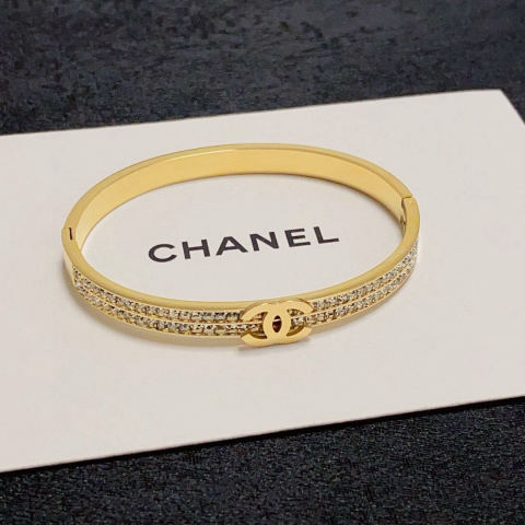 CHANEL C-shaped bracelet with double rows of diamond-encrusted C logo.