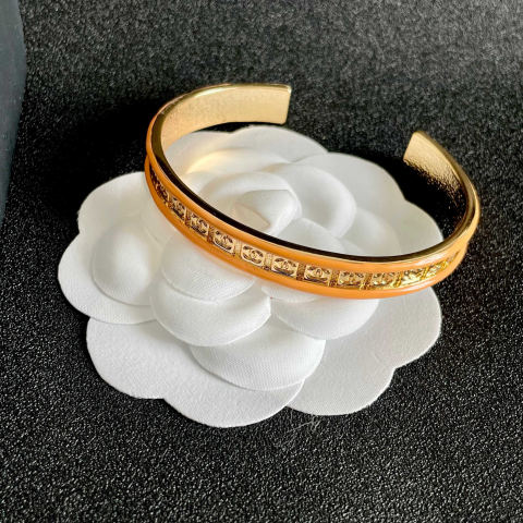 CHANEL double C logo engraved orange bracelet
